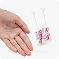 For Conceive Plus Fertility Lubricant Tube + Applicators bundle, the image shows two pre-filled 4g applicators alongside an open hand with a small amount of lubricant on the palm. The layout demonstrates product texture and usage, with clean white and pink branding on a light background.