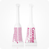 Image of two Conceive Plus fertility lubricant, pre-filled applicators 4g on a white background. Front of one applicator is towards camera while the other one has its back towards camera. White applicators with pink branding have information about manufacturer, company website url, quantity of lube, directions to apply, and storage directions.