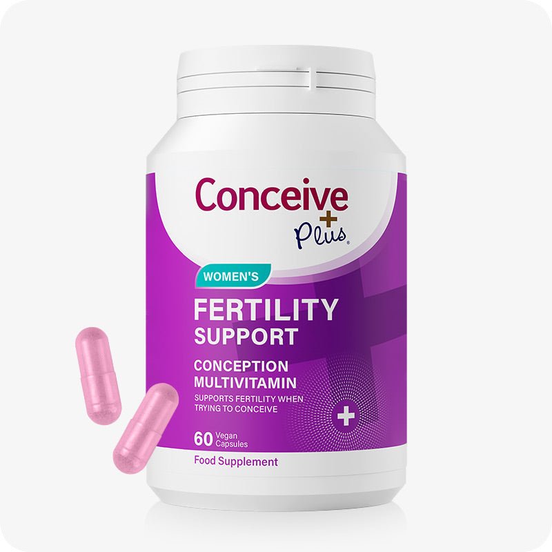Conceive Plus Max Couples Fertility Bundle featuring Women’s Fertility Support bottle with a purple label, displayed alongside two pink vegan capsules, formulated to support conception and reproductive health, set on a white background.