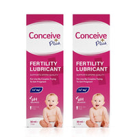 Image of two boxes of Conceive Plus try me size fertility lubricant 30ml on a white background. Pink and white label has white branding and highlights sperm quality support, pH balance, calcium and magnesium ions content, multi-use feature and quantity of the lube.